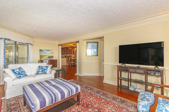 living room with wood-type flooring, a textured ceiling, and crown molding