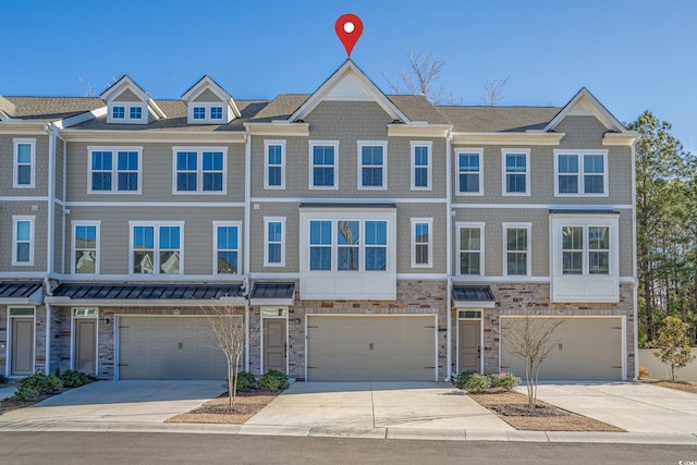 multi unit property featuring a garage