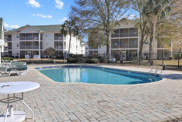 view of swimming pool with a patio area