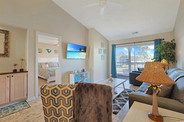 living room featuring lofted ceiling, ceiling fan, and light wood-type flooring