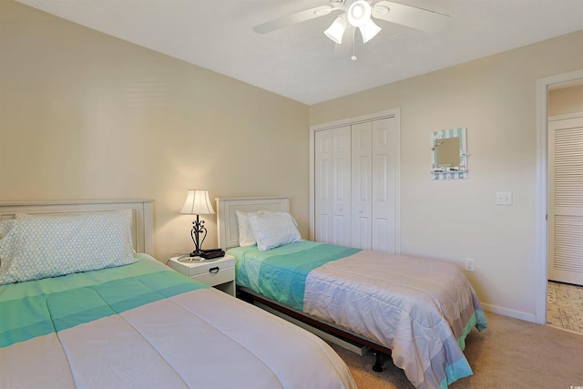 bedroom with light colored carpet, a closet, and ceiling fan