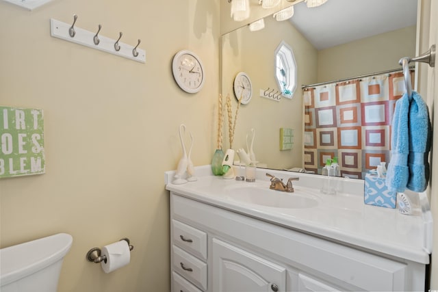 bathroom with vanity and toilet