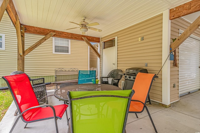 view of patio with a grill and ceiling fan