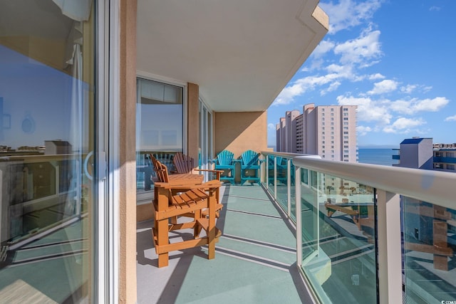 balcony featuring a water view