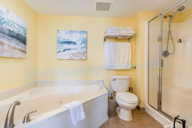 bathroom featuring shower with separate bathtub, tile patterned floors, and toilet