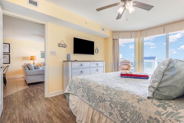 bedroom featuring dark hardwood / wood-style floors and ceiling fan