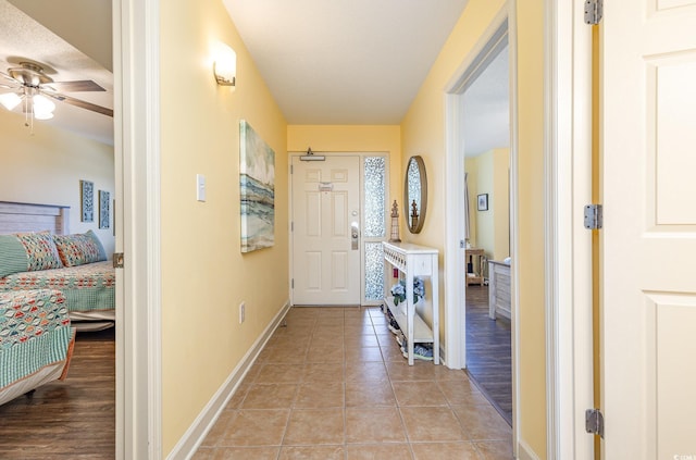 hallway featuring light tile patterned floors