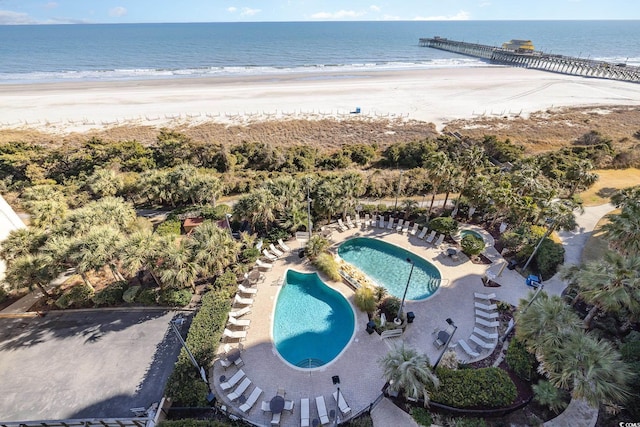 drone / aerial view with a water view and a view of the beach