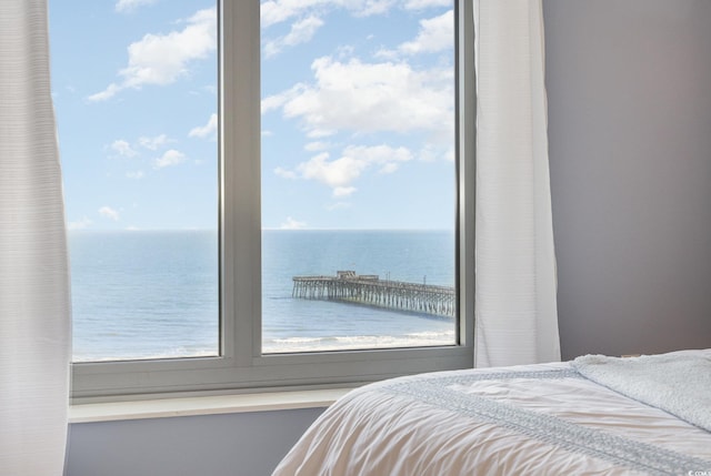 bedroom featuring a water view