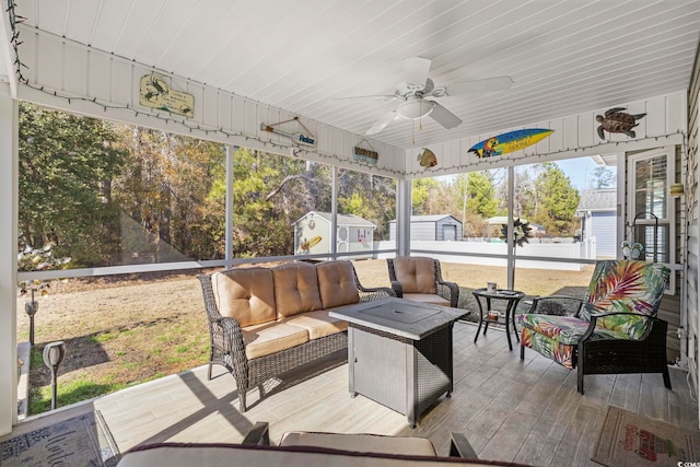 sunroom featuring ceiling fan and a wealth of natural light