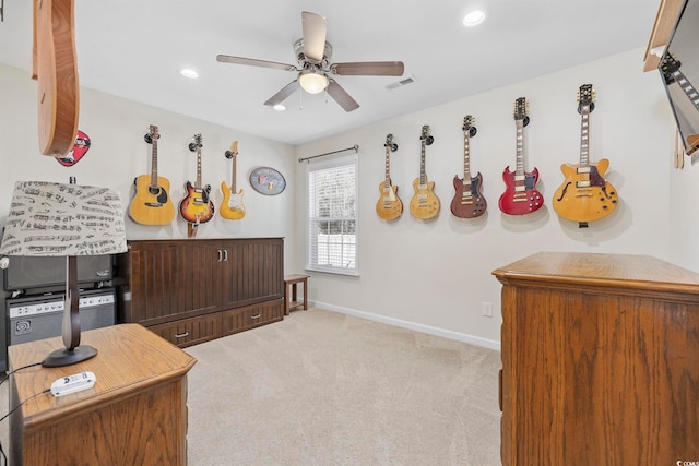 miscellaneous room featuring ceiling fan and light colored carpet