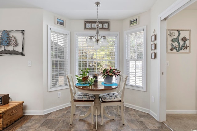 dining room with a notable chandelier