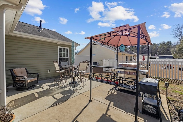 view of patio / terrace featuring a gazebo and a grill