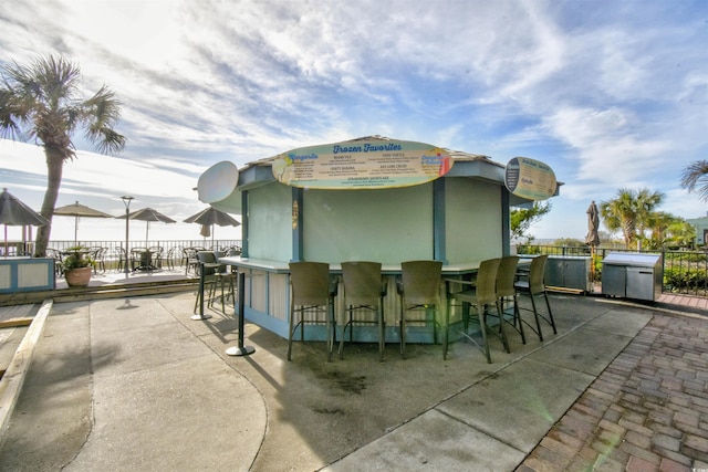 view of patio with a bar