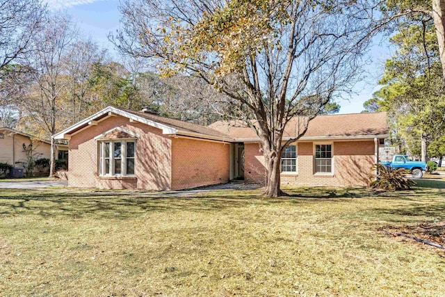 rear view of house with a yard