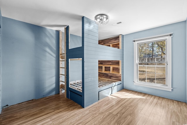 unfurnished bedroom featuring hardwood / wood-style floors