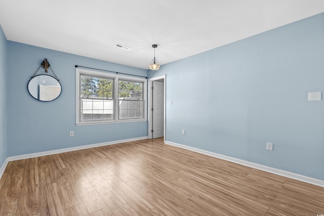 unfurnished room featuring light hardwood / wood-style floors