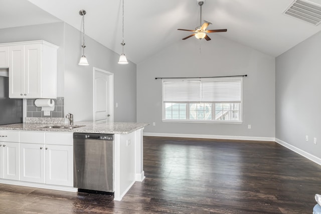 kitchen with white cabinetry, stainless steel dishwasher, light stone countertops, and sink