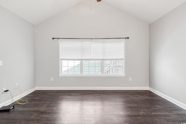 unfurnished room featuring dark hardwood / wood-style flooring, lofted ceiling, and ceiling fan