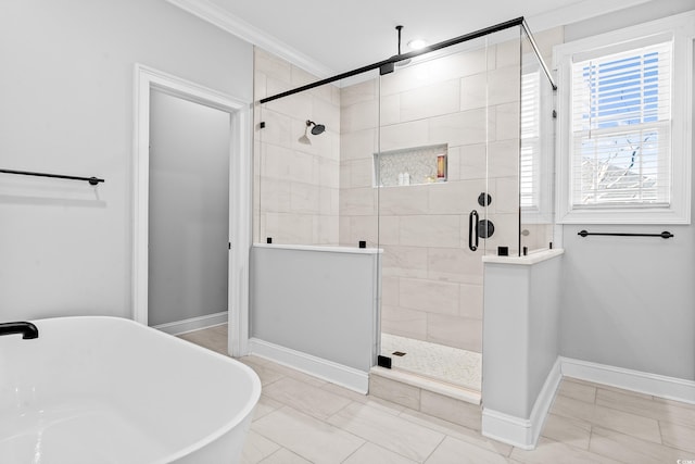 bathroom with shower with separate bathtub and ornamental molding