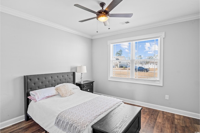 bedroom featuring crown molding, dark hardwood / wood-style floors, and ceiling fan