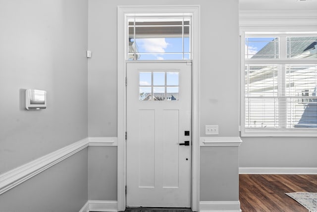 entryway with dark wood-type flooring