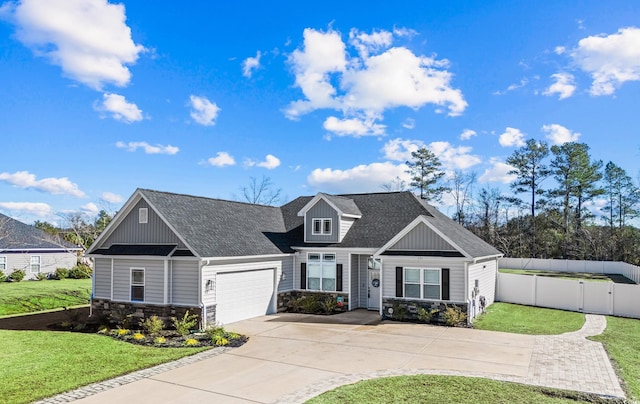 view of front of home featuring a garage and a front yard