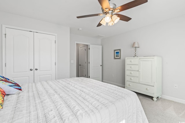 bedroom with light colored carpet, a closet, and ceiling fan