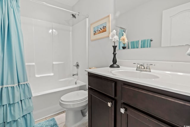 full bathroom featuring vanity, tile patterned floors, shower / bath combination with curtain, and toilet