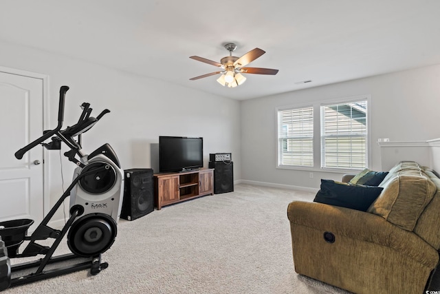 carpeted living room featuring ceiling fan