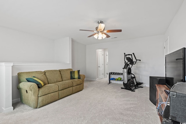 interior space featuring ceiling fan and carpet