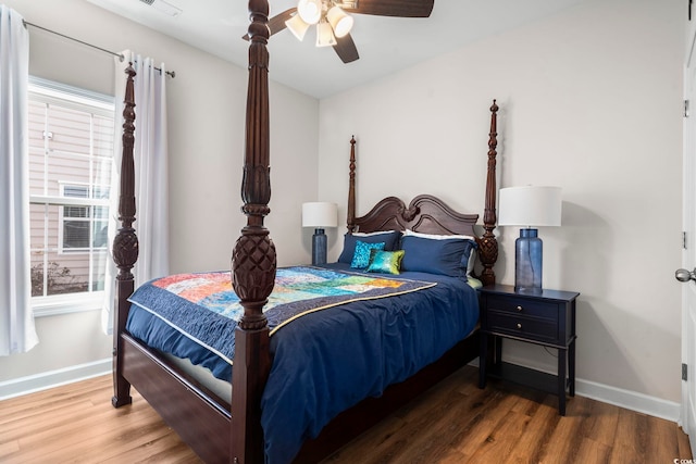 bedroom featuring hardwood / wood-style flooring and ceiling fan