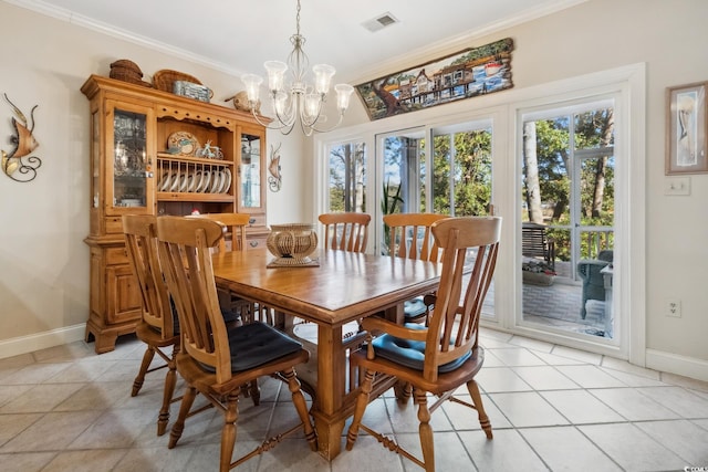 tiled dining area with ornamental molding and a chandelier