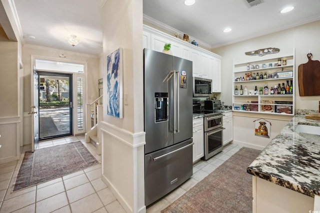489-3 Golden Bear Dr Unit 3, Pawleys Island, SC 29585 - kitchen with stainless steel appliances, crown molding, light tile patterned flooring, white cabinets, and open shelves
