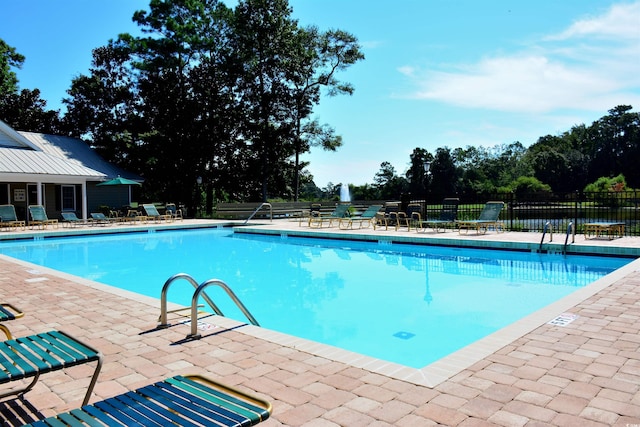 489-3 Golden Bear Dr Unit 3, Pawleys Island, SC 29585 - community pool with a patio area and view of scattered trees