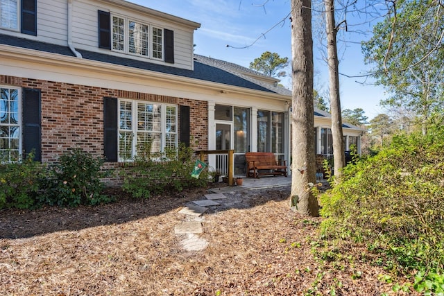 489-3 Golden Bear Dr Unit 3, Pawleys Island, SC 29585 - view of front of property featuring brick siding and a sunroom