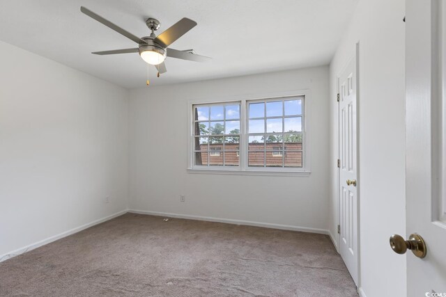1025 Carolina Rd Unit I-7, Conway, SC 29526 - unfurnished room featuring carpet, ceiling fan, and baseboards