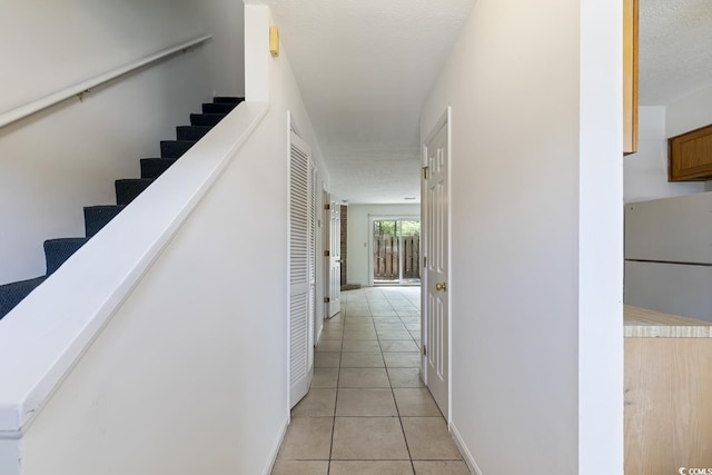 1025 Carolina Rd Unit I-7, Conway, SC 29526 - hall featuring light tile patterned floors, stairway, and baseboards