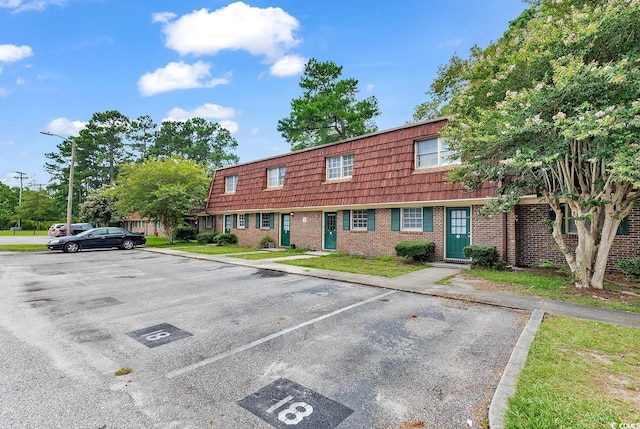 1025 Carolina Rd Unit I-7, Conway, SC 29526 - townhome / multi-family property featuring uncovered parking, mansard roof, and brick siding