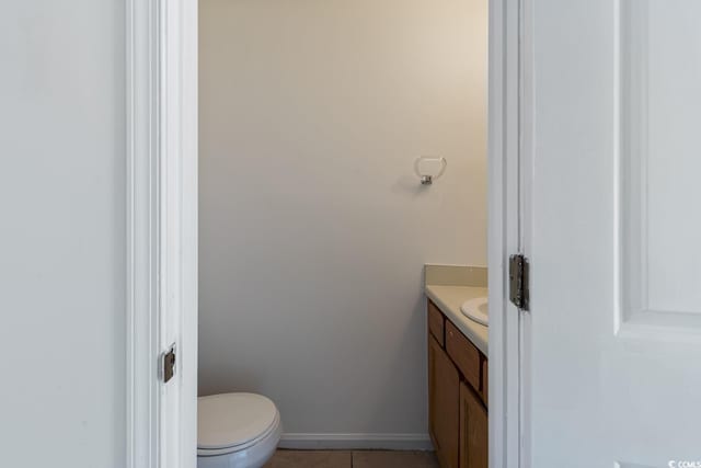 1025 Carolina Rd Unit I-7, Conway, SC 29526 - bathroom featuring vanity, toilet, tile patterned floors, and baseboards