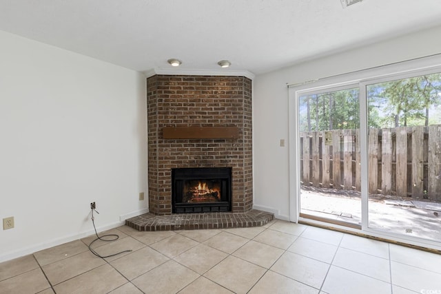 1025 Carolina Rd Unit I-7, Conway, SC 29526 - unfurnished living room featuring tile patterned floors, a brick fireplace, and baseboards