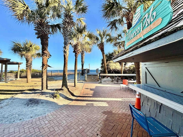 view of patio featuring a water view