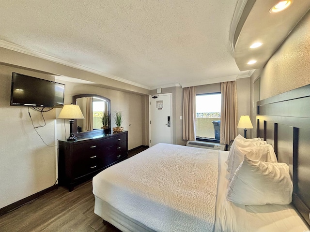 bedroom featuring crown molding, a textured ceiling, and wood finished floors