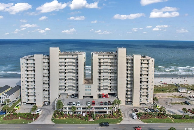 bird's eye view with a water view and a view of the beach