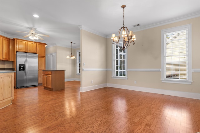 kitchen with ceiling fan with notable chandelier, hanging light fixtures, stainless steel fridge with ice dispenser, crown molding, and light wood-type flooring