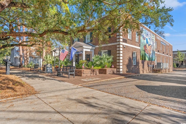 view of front of home featuring brick siding