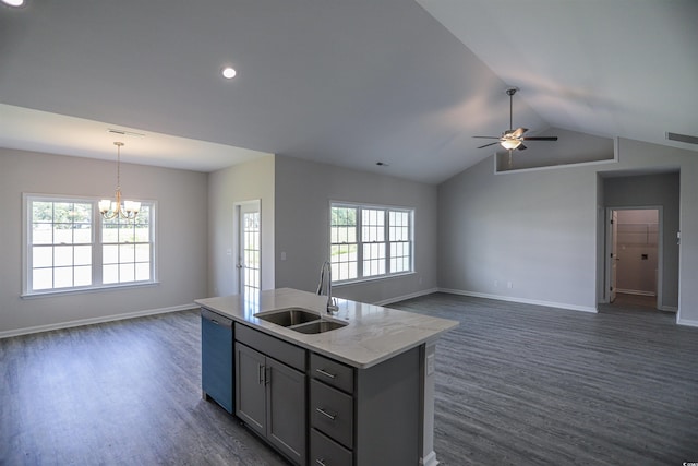 kitchen featuring visible vents, a sink, open floor plan, dishwashing machine, and dark wood-style flooring