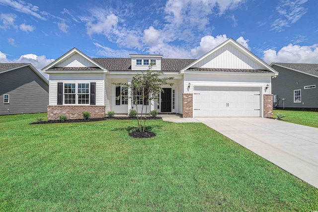 craftsman inspired home with brick siding, an attached garage, concrete driveway, and a front lawn