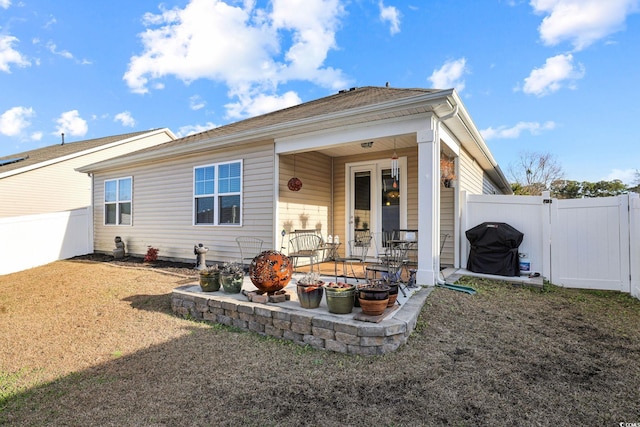 back of house with a patio