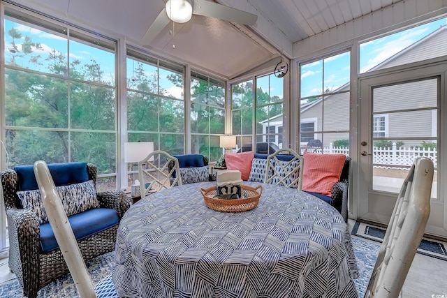 sunroom featuring ceiling fan